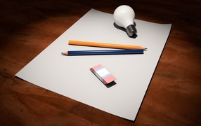 Лист бумаги, карандаши, ластик и лампочка на столе