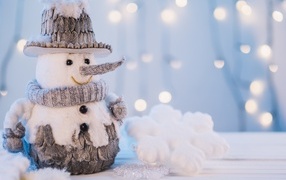 Beautiful toy snowman on the table