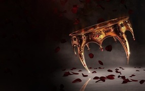 Golden crown with red rose petals