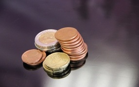 Euro coins on a gray table
