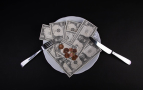 Plate with dollars on a black background
