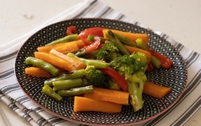 Baked vegetables on a beautiful plate on the table