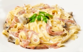 Noodles with bacon and mushrooms on white background