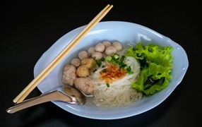 Rice noodles with vegetables in a plate