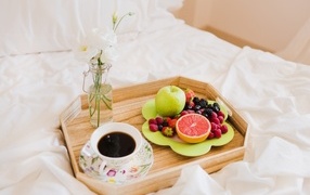 Fruits and a cup of coffee for your beloved in bed