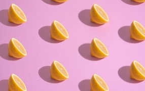 Lemon halves on a pink background