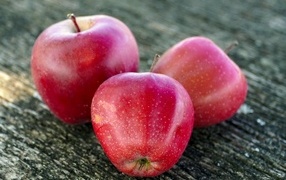 Three large ripe red apples