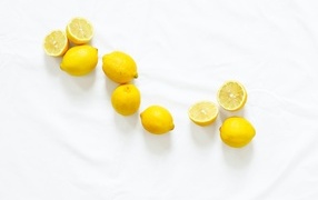 Yellow sour lemons on a white background