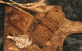 Black bread with seeds on the board