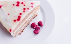 Pie with raspberries on a white plate