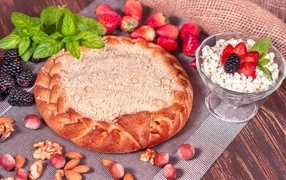 Sweet pie with berries on the table