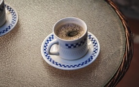 Beautiful cup of fragrant coffee on the table
