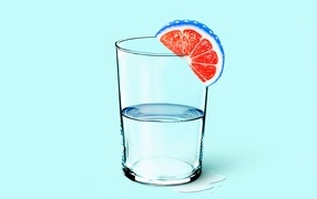 Glass of water with a slice of orange on a blue background