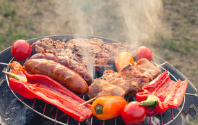 BBQ meat on grill with vegetables