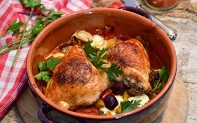 Baked chicken with vegetables in a pan