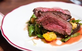 Steak with vegetables on a plate