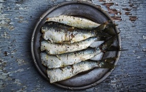 Sardines in a large plate on the table