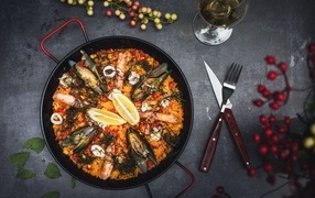 Seafood dish in a frying pan on the table