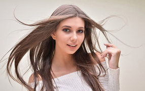 Girl with long hair on a white background