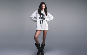 Long-legged girl model Kendall Jenner on a gray background
