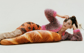 Model Emily Ratajkowski lies on the floor