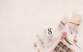 Gifts on a pink background for your beloved on March 8