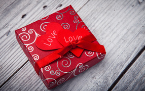 Big red gift with hearts for Valentine's Day