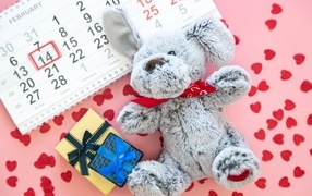 Toy and calendar on pink background