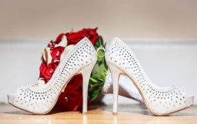 White shoes of the bride and bouquet