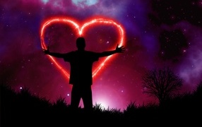 A man draws a red heart in the night sky