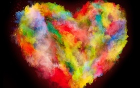Сердце из разноцветных красок на черном фоне
