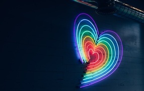 Neon heart on a gray wall