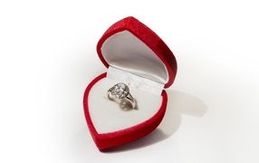 Ring in a red box in the shape of a heart for your beloved