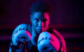 Man in boxing gloves on a black background
