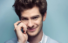 Actor Andrew Garfield on a gray background