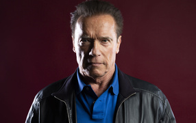 Popular actor Arnold Schwarzenegger on a red background