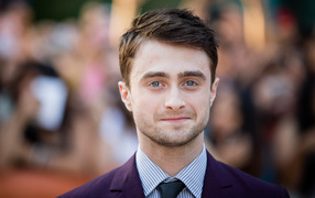 Popular blue-eyed man Daniel Radcliffe in a suit