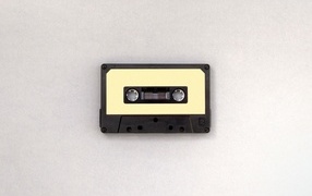 Old cassette tape on gray background