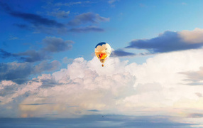 Hot air balloon in the sky with white clouds