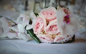 Wedding bouquet with pink rose flowers and orchid flowers