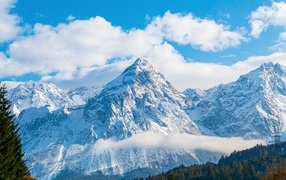 Snow covered Dolomites under blue sky