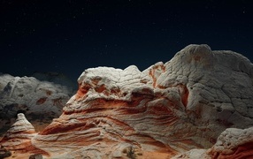 Unusual mountains under the starry sky at night