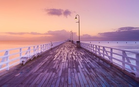 Long wooden bridge by the sea