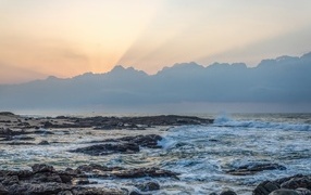 Sunrise in the clouds over the sea