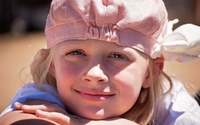 Little girl in a pink hat