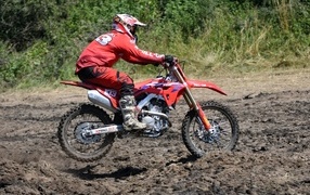 A man on a motorcycle rides off-road