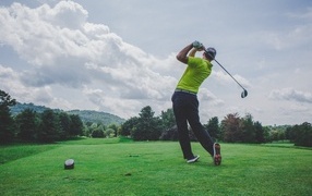 Man playing golf on the course