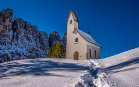 Old church in the mountains in the snow