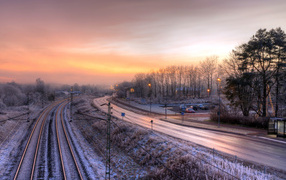 Sunrise view over a snow-covered railway