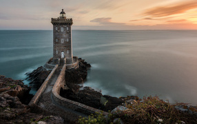 Ancient lighthouse on the seashore, France